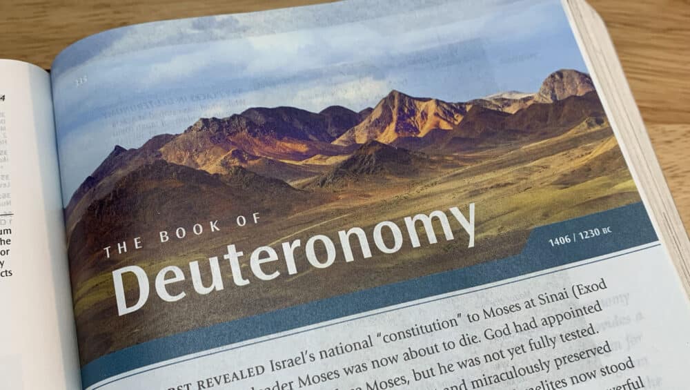 Deuteronomy Moses Bible open to book of Deuteronomy